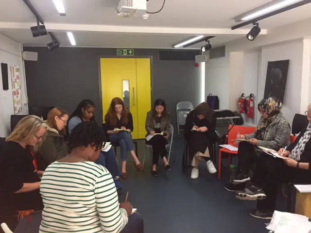 Participants in a circle writing workshop